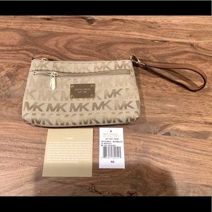 Brand new fabric and leather Michael Kors wristlet in beige.